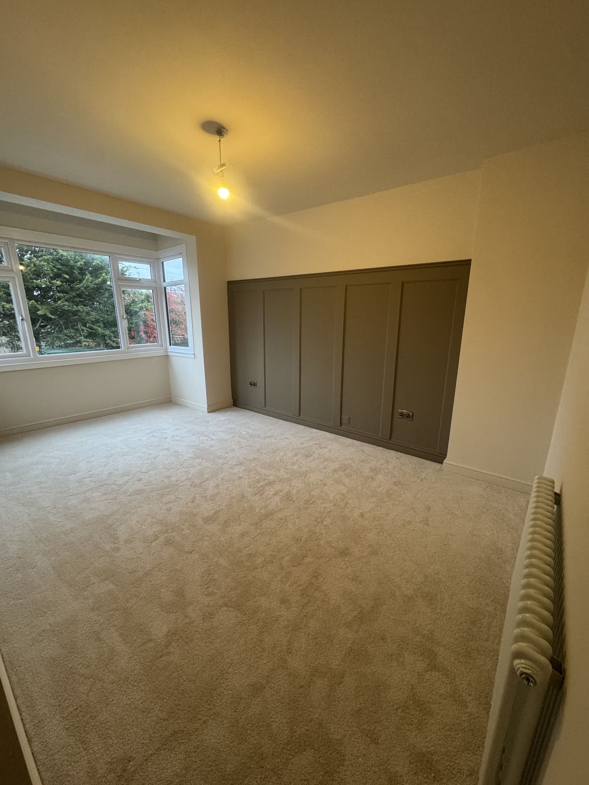 Decorative panelling and soft finish in a bedroom by Hamilton Decorating, East Sussex